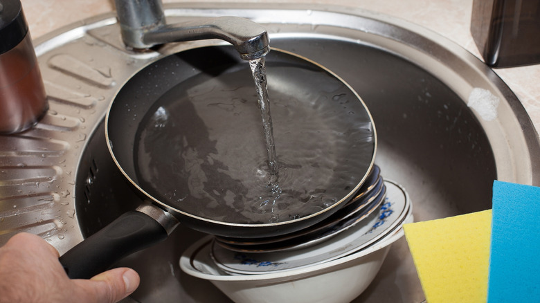 Pan under running water