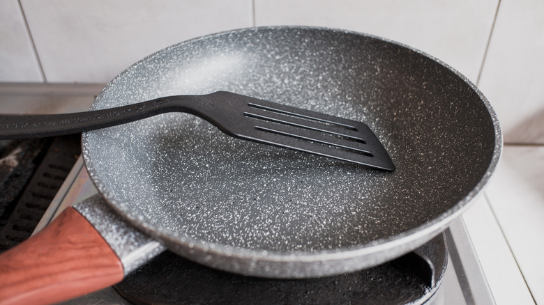 Nonstick pan with a plastic spatula