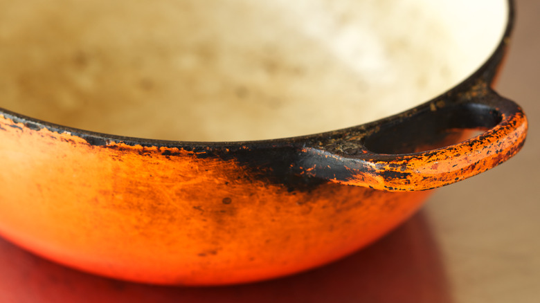 Closeup of damage on an enameled pan