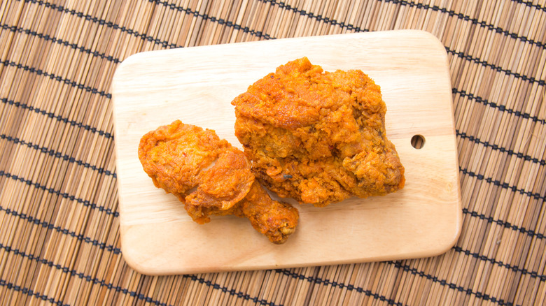 Fried chicken on a wooden board