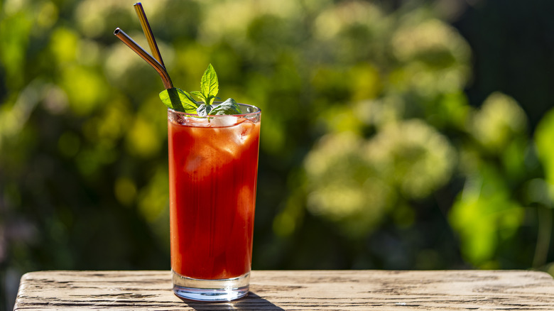 A Bloody Mary cocktail in a tall glass outside