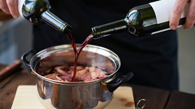 Pouring wine into pot