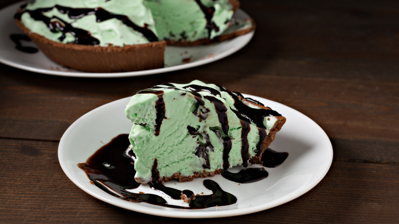 Grasshopper pie slice with whole pie in background