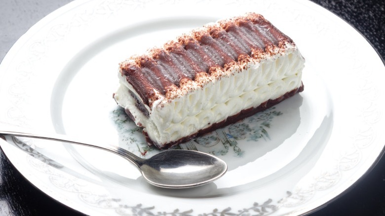 A slice of Viennetta sits on a plate.