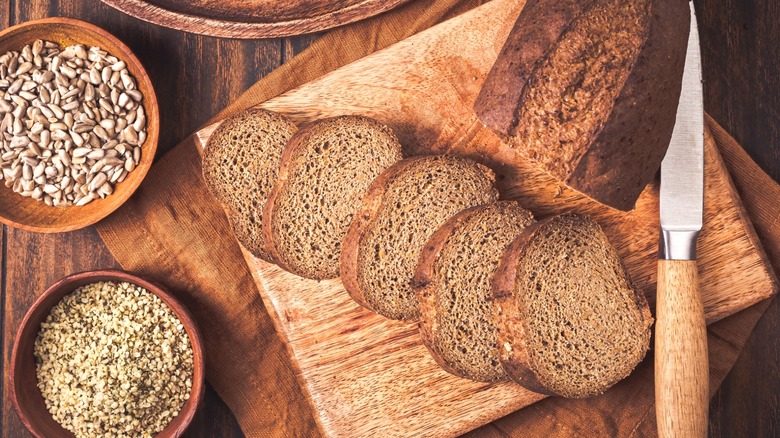 Glute-free bread sliced on wood cutting board