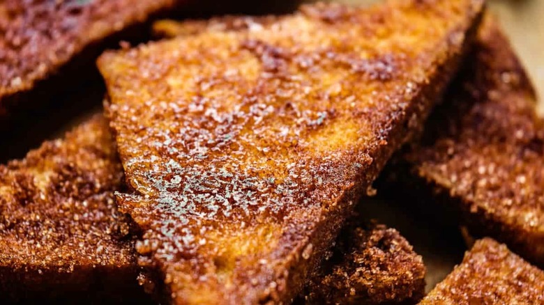 A stack of cinnamon toast cookies in triangles