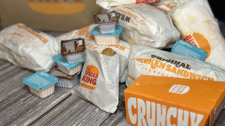 Pile of all Burger King chicken items on table surface.