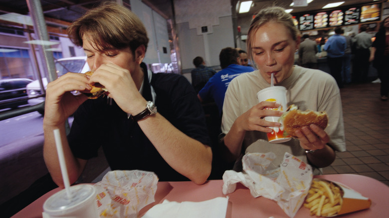 Old-school Burger King restaurant, with couple eating