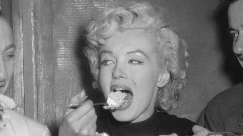 Marilyn Monroe eating cake