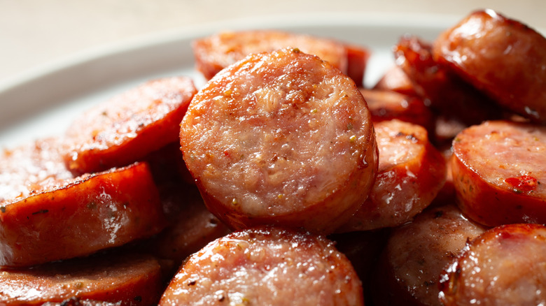 Slices of browned Cajun andouille sausage