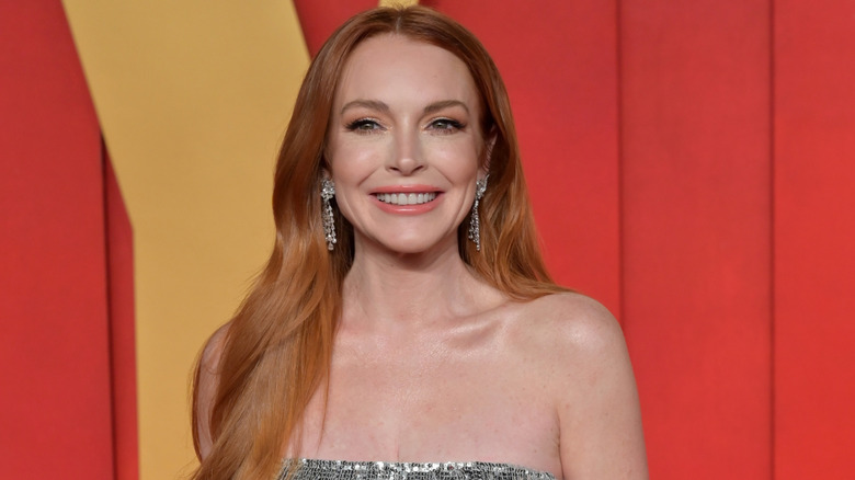 Lindsay Lohan smiles at the 2024 Vanity Fair Oscar Party