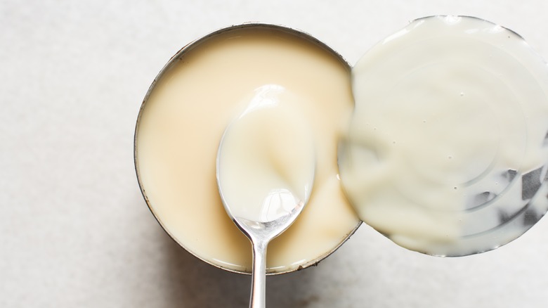 overhead of opened can of sweetened condensed milk can