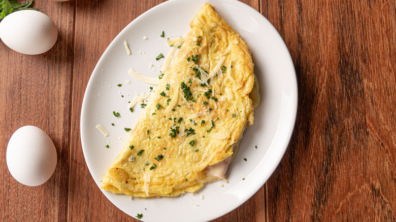 Top view of cheese omelet on white plate