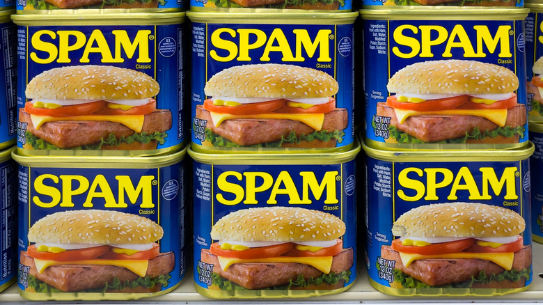 Six cans of Spam stacked atop each other