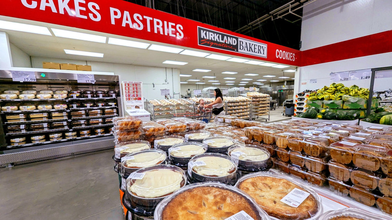 The Kirkland Signature Bakery inside of a Costco with cakes, pies, cookies, and more on display