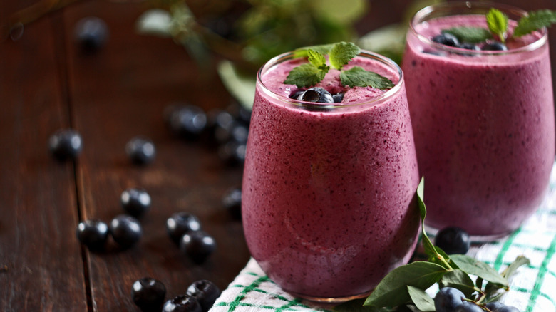 Two glasses of blueberry smoothies