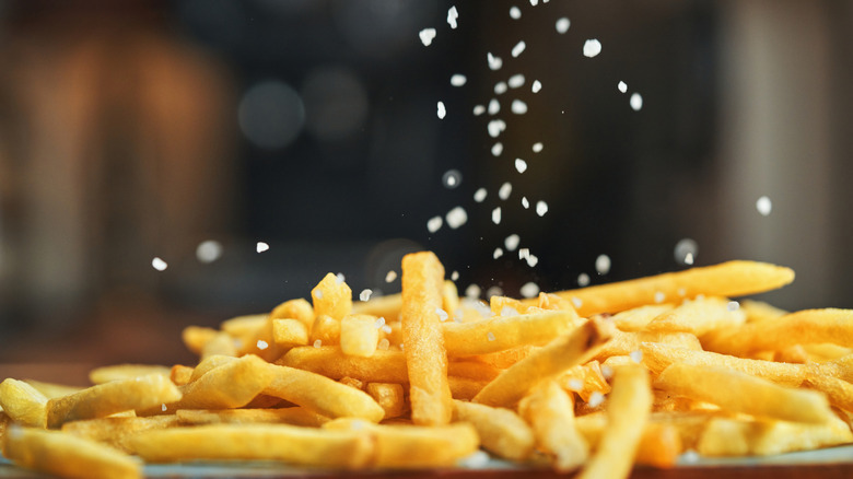 Adding salt to crispy french fries