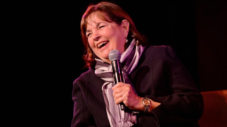 Ina Garten laughing into a microphone