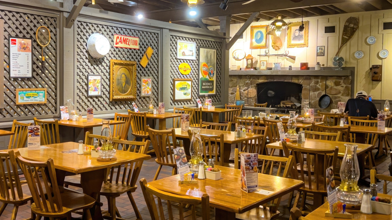 The interior of a Cracker Barrel location with one customer sitting in it.