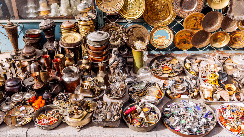 A table full of various types of dishware and utensils