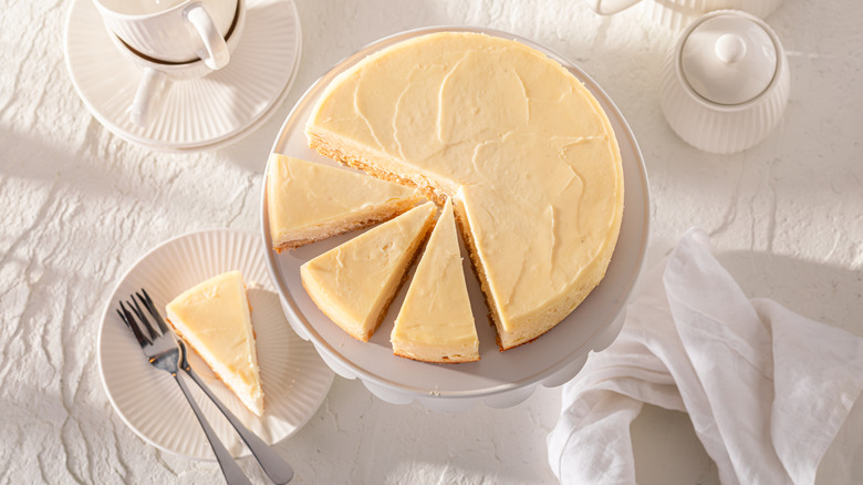 Fresh New York cheesecake served on white table.