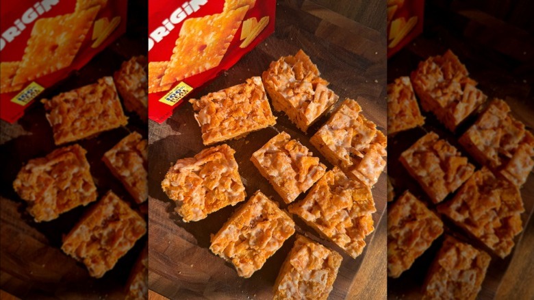 Cheez-It marshmallow squares on a wooden surface with a box of Cheez-It crackers