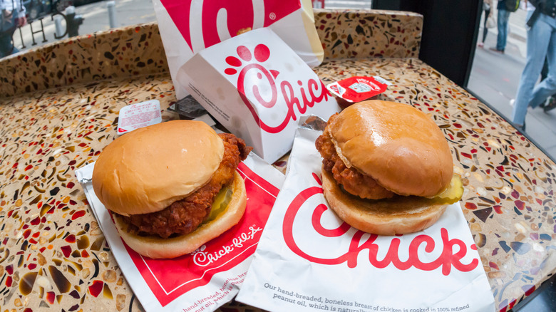 A classic Chick-fil-A Chicken Sandwich and a Spicy Chicken sandwich in a Chick-fil-A restaurant in New York.