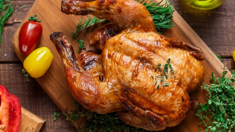 Roasted chicken on wood board