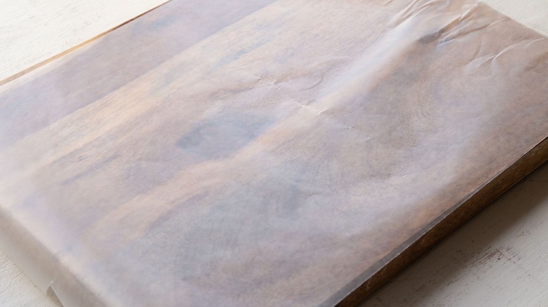 Sheet of parchment paper on top of cutting board