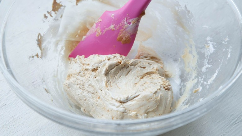 Marshmallow nougat in bowl with pink spatula