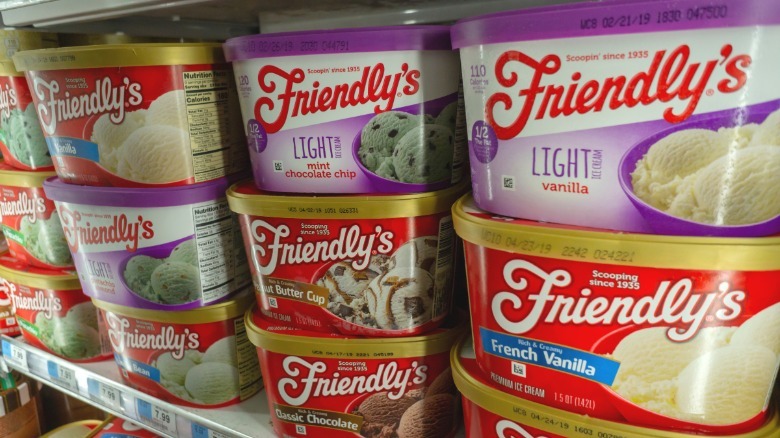 Tubs of Friendly's ice cream stacked inside a grocery store freezer