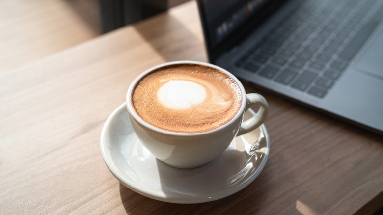 a cup of foamy coffee