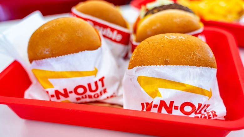 In-N-Out burgers wrapped in paper on tray
