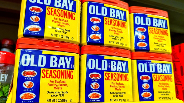 tins of Old Bay seasoning on a grocery store shelf