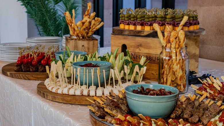 Elegant appetizer tray filled with different options of meats and vegetables