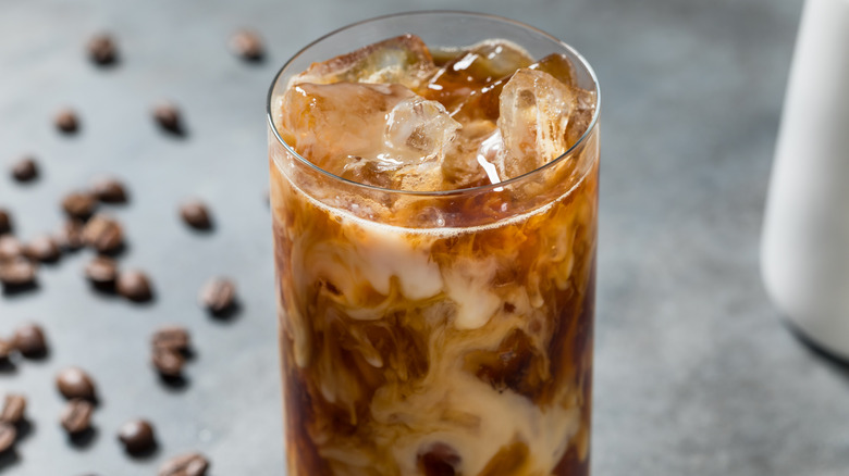 A glass of iced cold brew coffee and milk