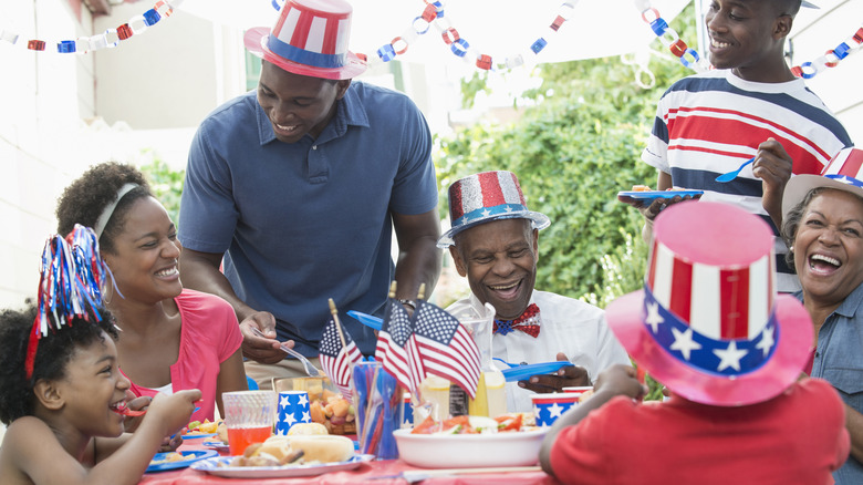 Family enjoying Fourth of July cookout