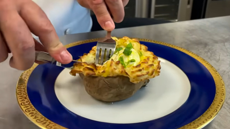 Eggs Suzette on white and blue plate with a gold rim