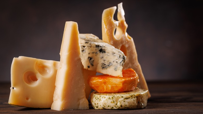 Assortment of cheese wedges on a table