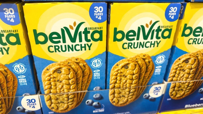 Boxes of Belvita Crunchy breakfast bars on a supermarket shelf.