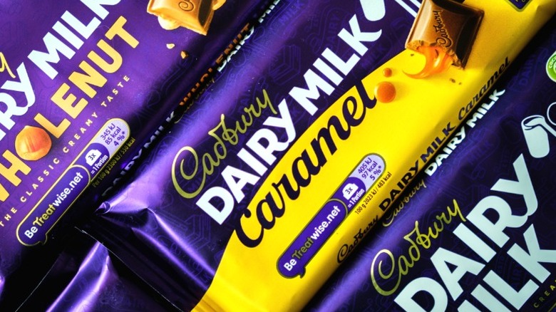 Several Cadbury chocolate bars laid out next to each other diagonally.
