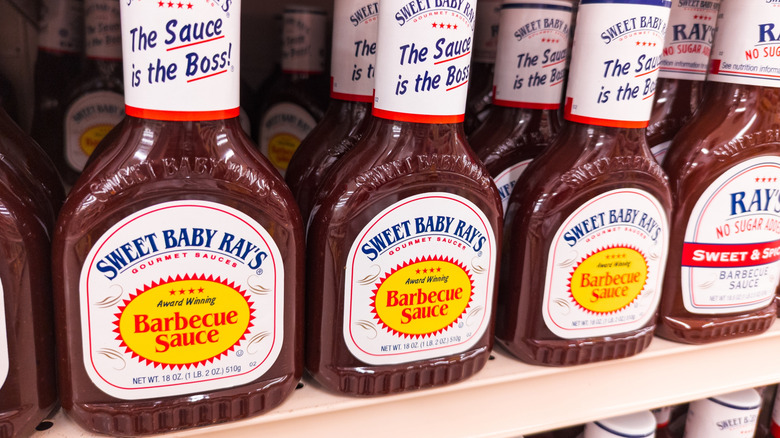 Bottles of Sweet Baby Ray's barbecue sauce on a store shelf