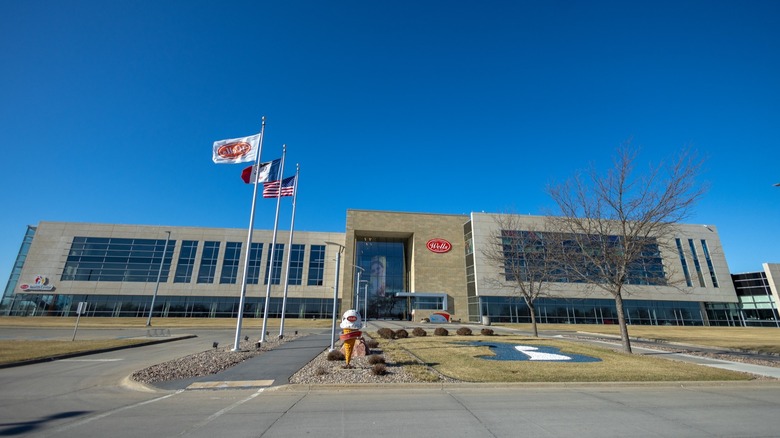 Wells Enterprises building with three flags in front