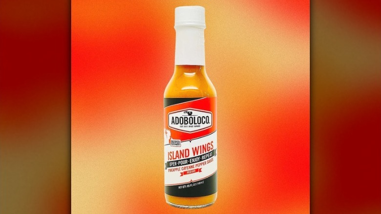 A bottle of Adoboloco Island Wings Hot Sauce.