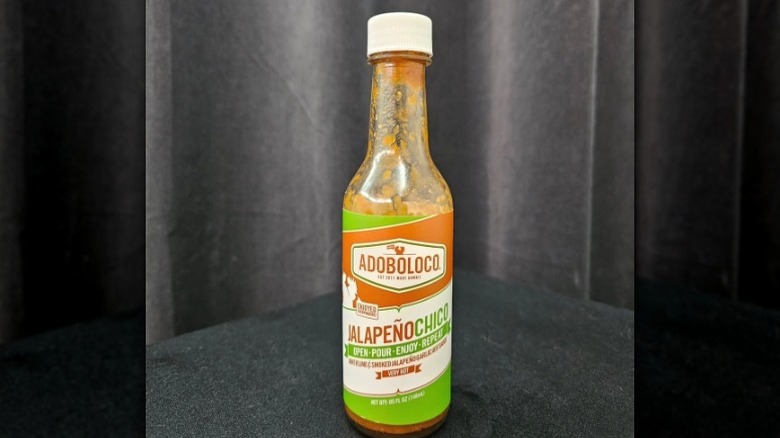 A bottle of Adoboloco Jalapeño Chico Hot Sauce.