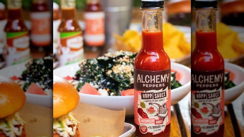 A bottle of Alchemy Peppers Watermelon Ghost Hot Sauce.