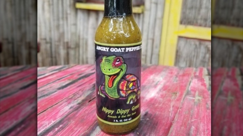 A bottle of Angry Goat Hippy Dippy Green Hot Sauce.