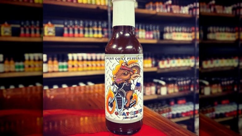 A bottle of Angry Goat Pepper Co. Goat Rider Hot Sauce.