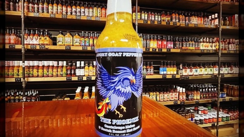 A bottle of Angry Goat Pepper Co. The Phoenix Hot Sauce.