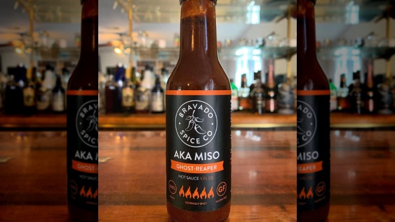 A bottle of Bravado Spice Company Aka Miso Ghost-Reaper Hot Sauce.
